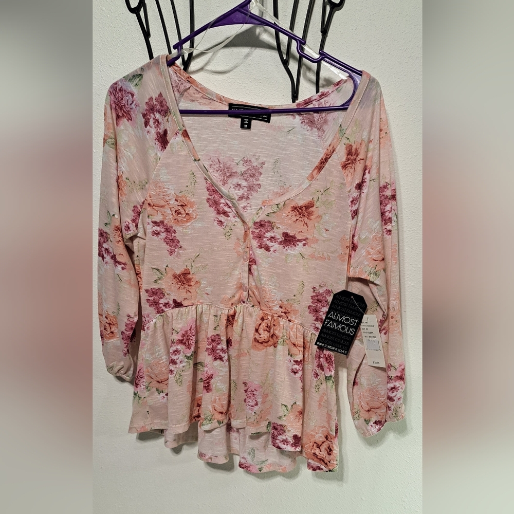 Almost Famous Pink Floral Peplum Blouse NWT. sz. M